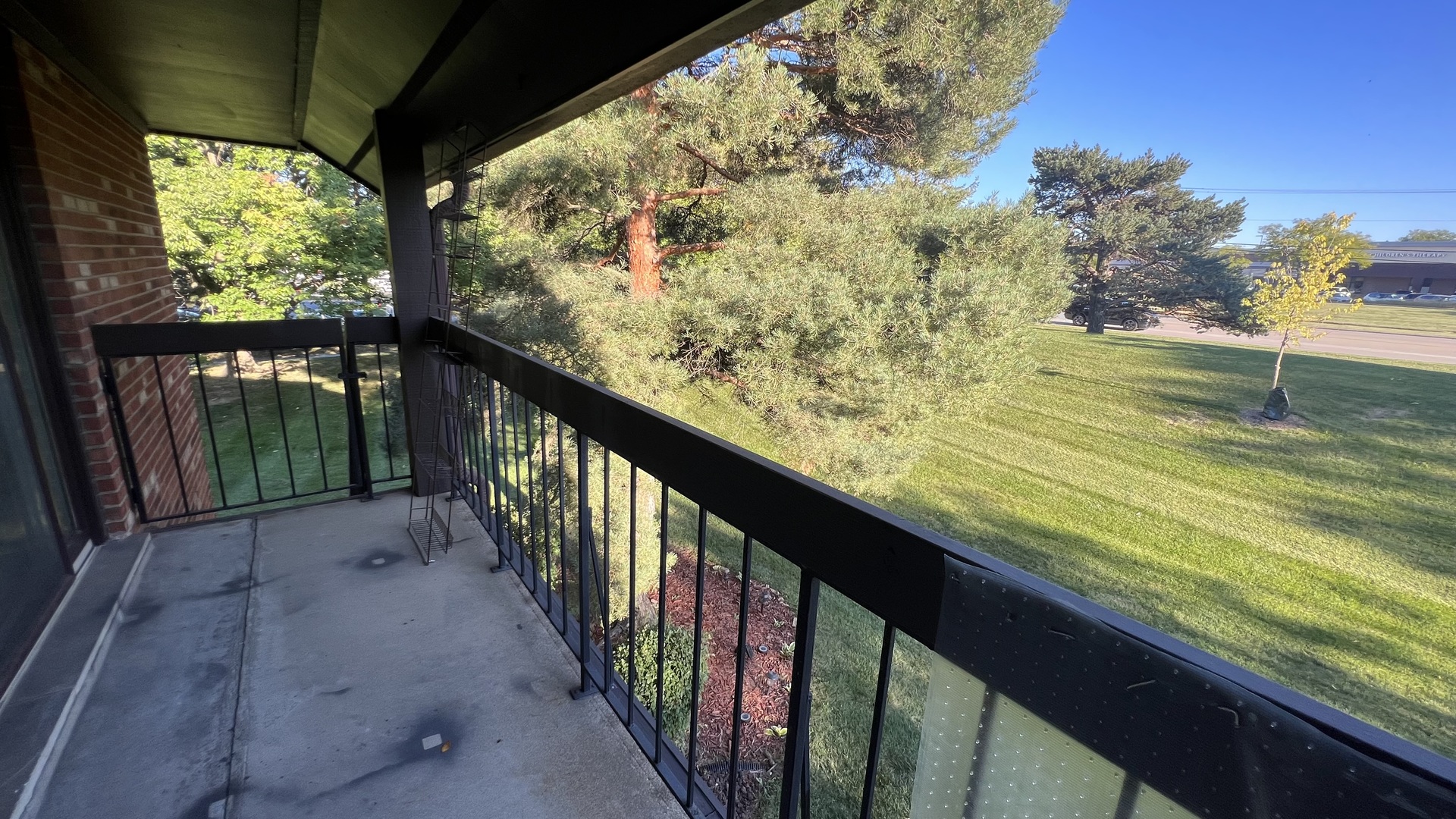 121 Windsor Lane, Unit D Willowbrook, IL 60527 - Photo 18 of 23 a view of balcony with wooden floor and fence