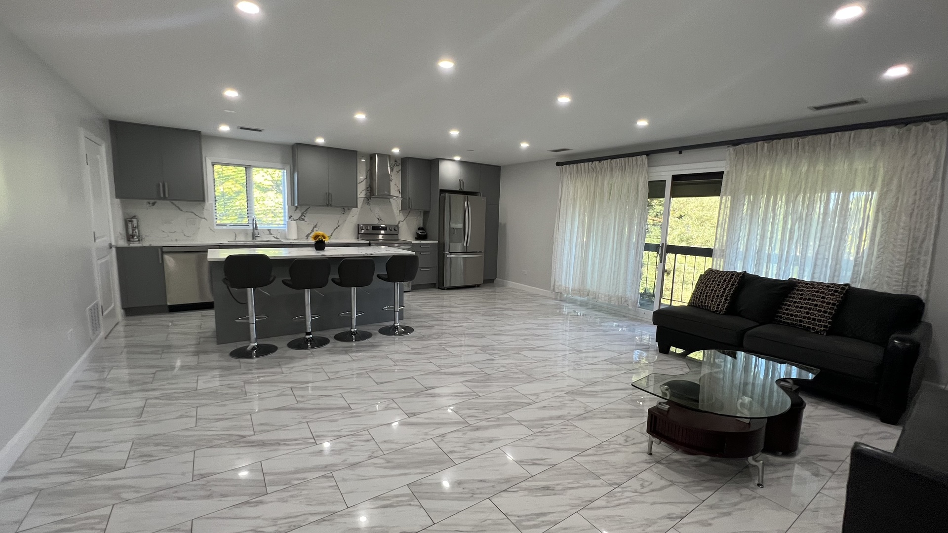 121 Windsor Lane, Unit D Willowbrook, IL 60527 - Photo 2 of 23 a living room with furniture and a large window