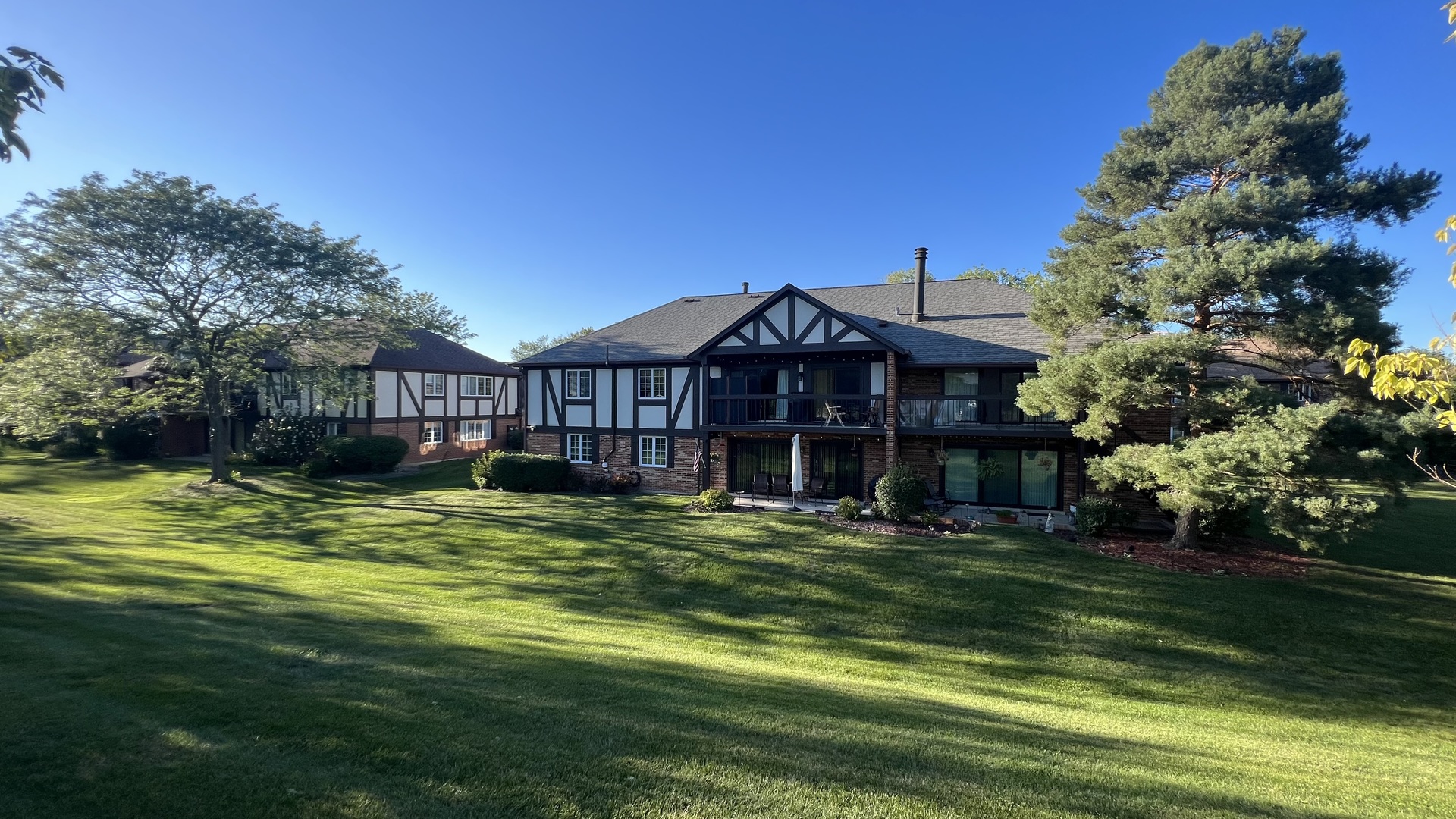121 Windsor Lane, Unit D Willowbrook, IL 60527 - Photo 23 of 23 a front view of a house with a garden