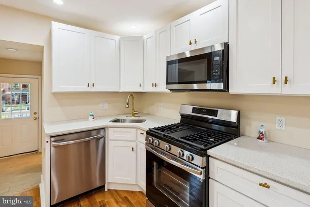 a kitchen with a stove and a microwave
