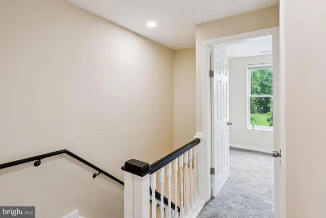 a bathroom with a toilet a sink and a mirror