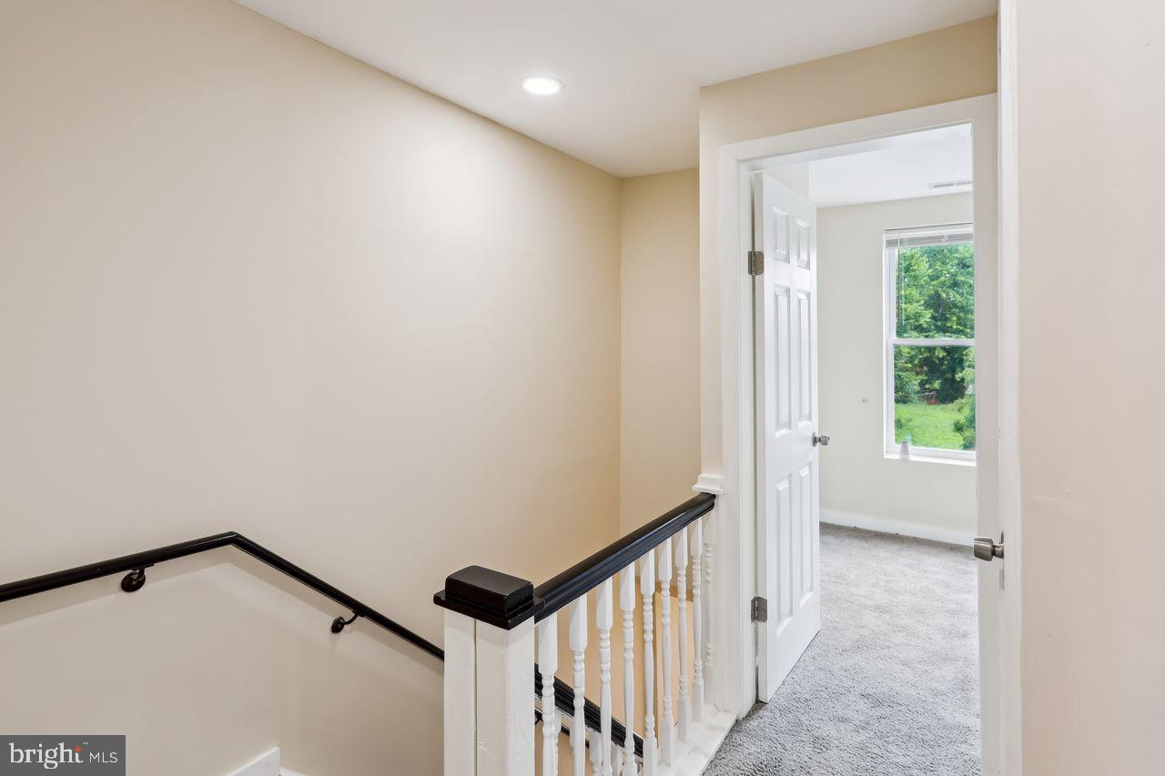 3701 Manchester Avenue Baltimore, MD 21215 - Photo 17 of 34 a view of a hallway with wooden floor and entryway