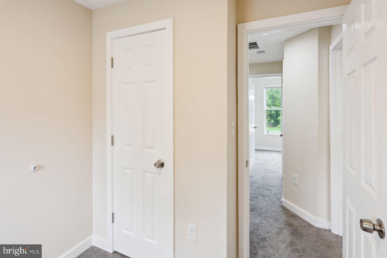 3701 Manchester Avenue Baltimore, MD 21215 - Photo 24 of 34 a view of a bathroom with a glass door