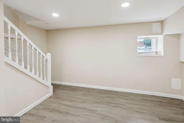a view of an entryway with wooden floor