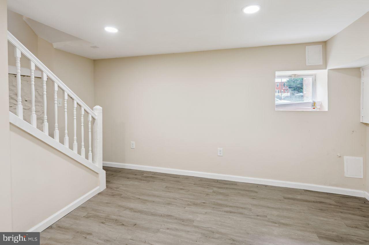 3701 Manchester Avenue Baltimore, MD 21215 - Photo 31 of 34 a view of an empty room with wooden floor