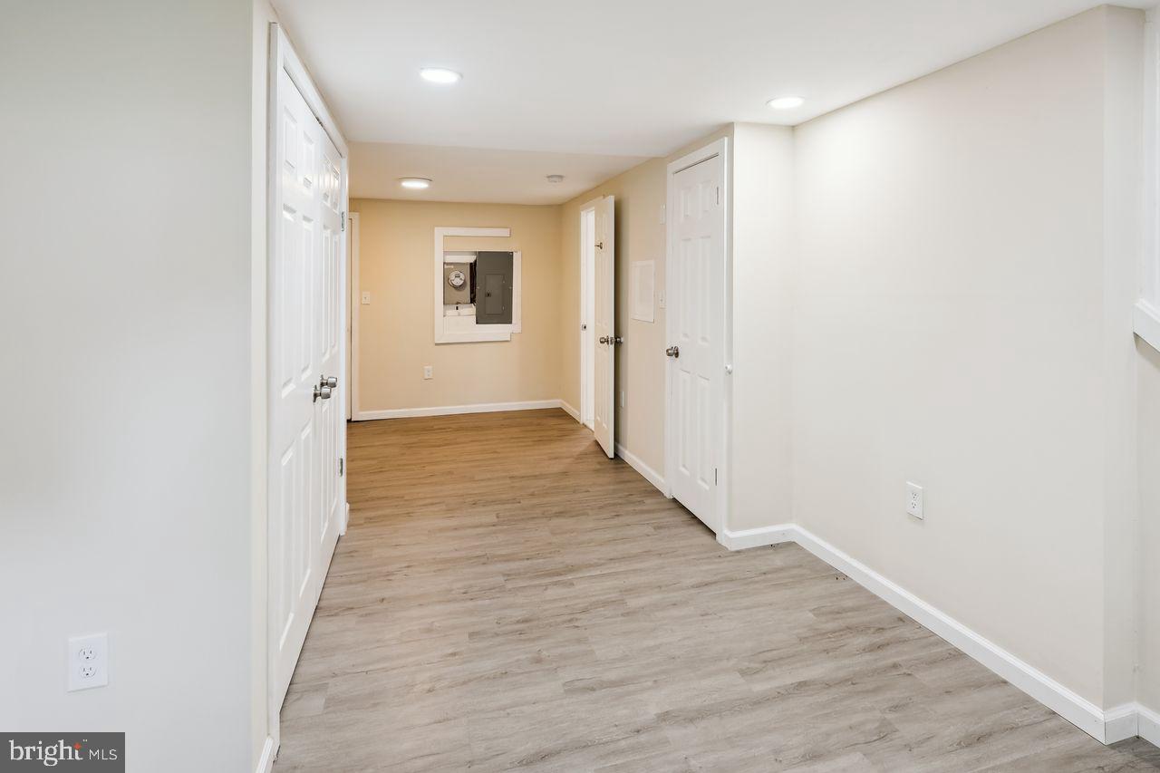 3701 Manchester Avenue Baltimore, MD 21215 - Photo 33 of 34 a view of a hallway with wooden floor