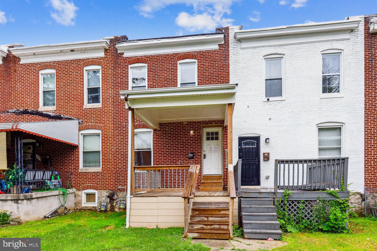 3701 Manchester Avenue Baltimore, MD 21215 - Photo 4 of 34 front view of a house with a yard