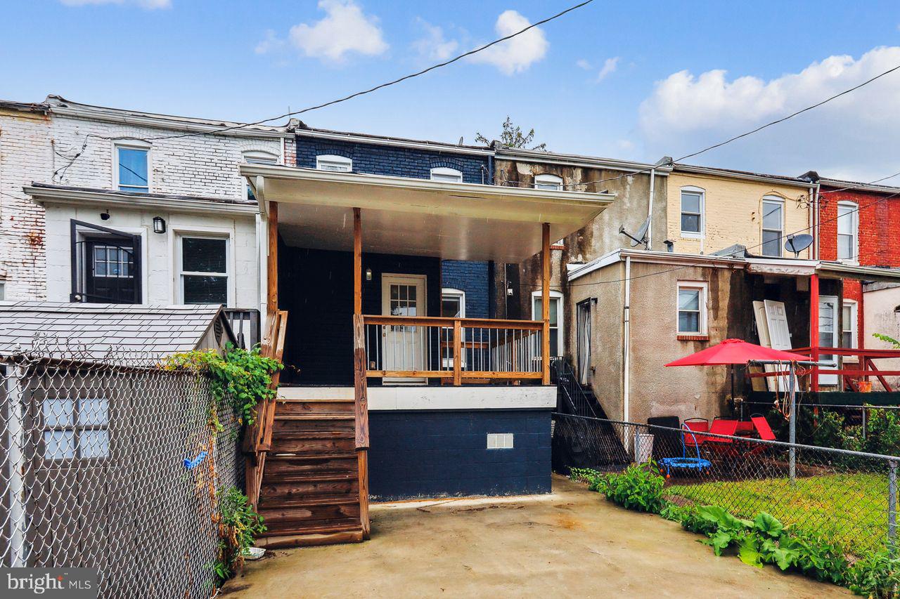 3701 Manchester Avenue Baltimore, MD 21215 - Photo 6 of 34 a view of a building with a porch