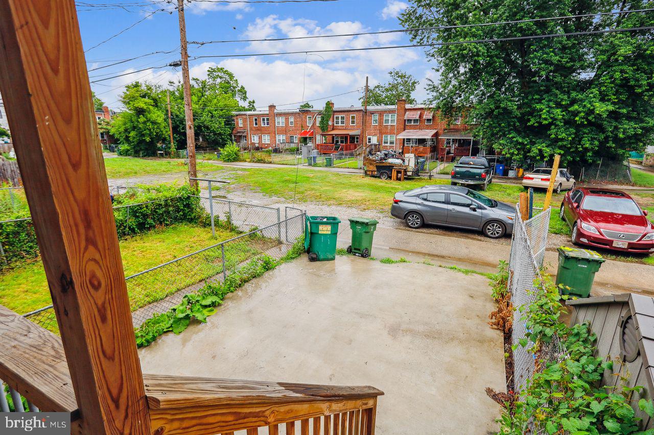 3701 Manchester Avenue Baltimore, MD 21215 - Photo 8 of 34 a view of swimming pool with seating area and trees in the background