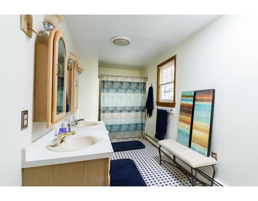 101 Olympia Road Marshfield, MA 02050 - Photo 17 of 24 a bathroom with a sink toilet and a mirror