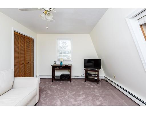 101 Olympia Road Marshfield, MA 02050 - Photo 18 of 24 a living room with furniture and a flat screen tv