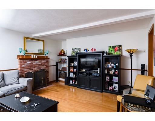 101 Olympia Road Marshfield, MA 02050 - Photo 3 of 24 a living room with furniture and a flat screen tv