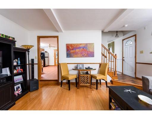 101 Olympia Road Marshfield, MA 02050 - Photo 6 of 24 a living room with furniture and a flat screen tv