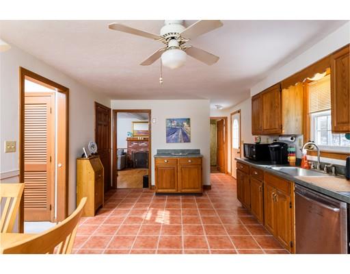 101 Olympia Road Marshfield, MA 02050 - Photo 7 of 24 a room with stainless steel appliances furniture a large window and a couch