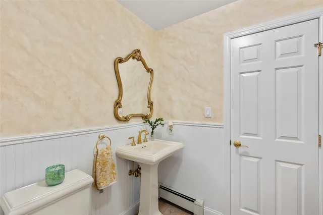 a living room with furniture a fireplace and a large window