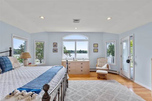 a bed room with a bed and a chair