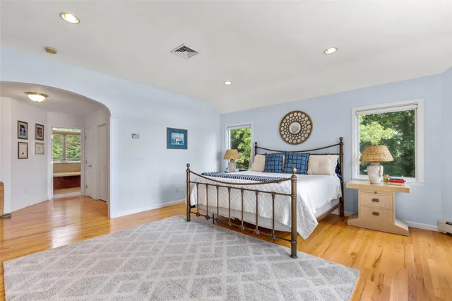 a view of a wooden deck with lake view