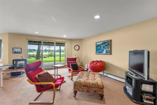 a room with pool table and windows