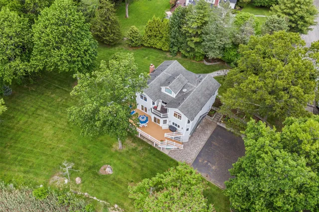 a view of a lake with houses in the back