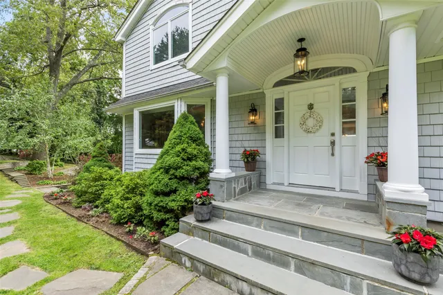 a front view of a house with a porch