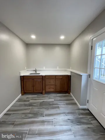 a kitchen with a sink and a stove