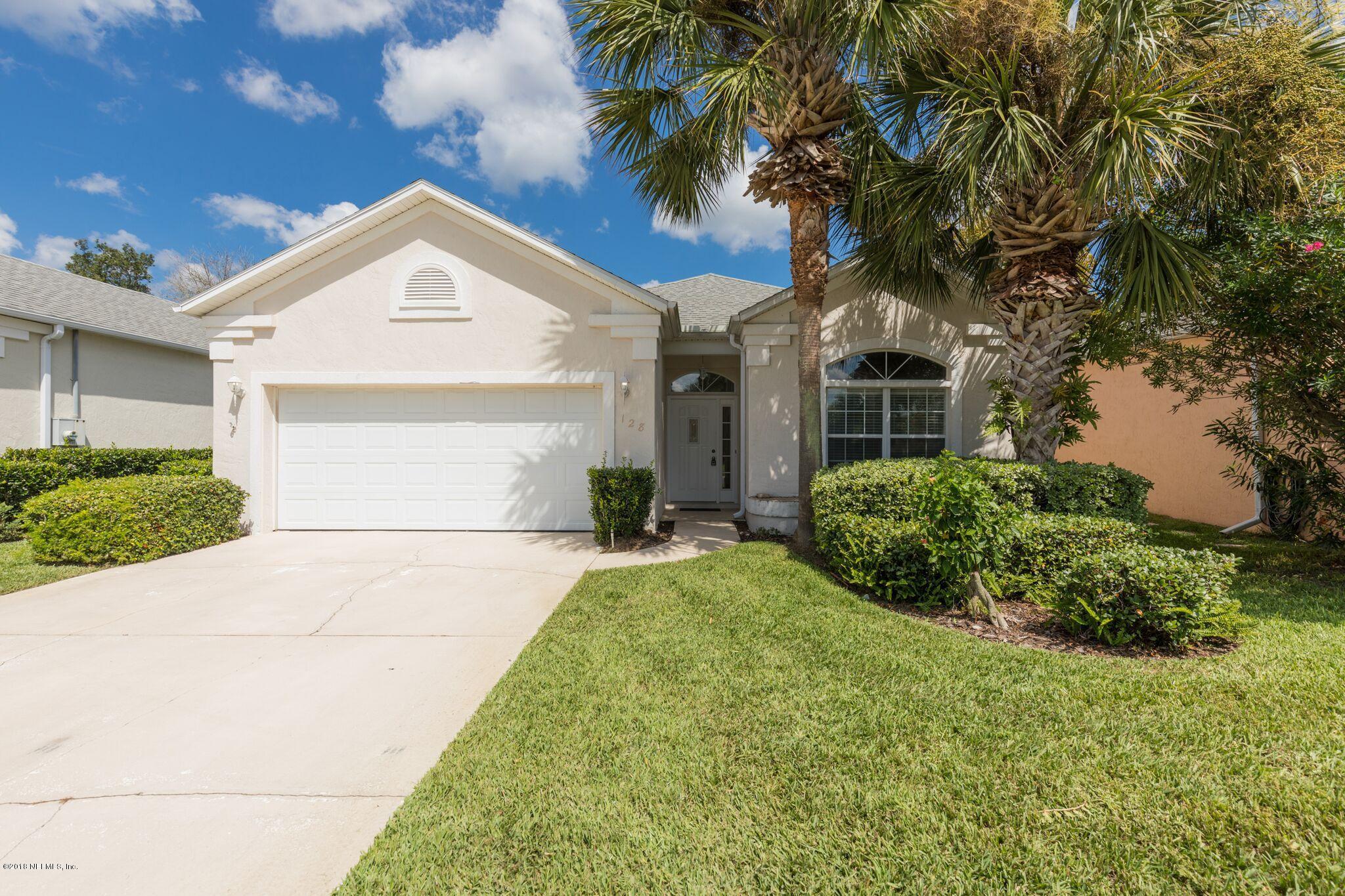 128 Cedar Ridge Circle St. Augustine, FL 32080 - Photo 1 of 37 a front view of a house with a yard