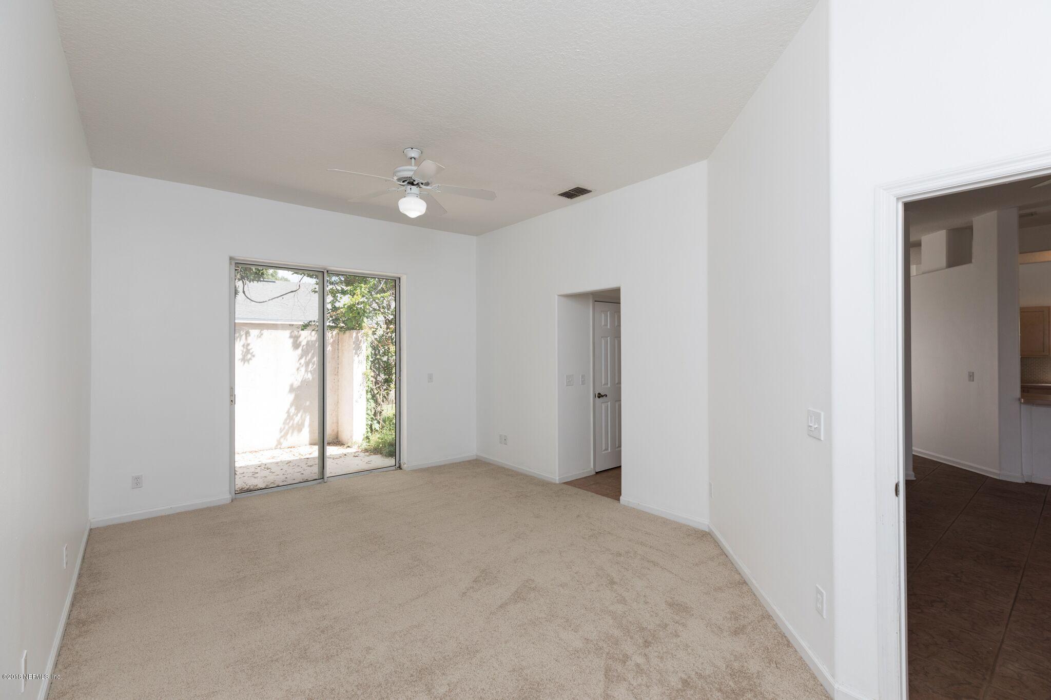 128 Cedar Ridge Circle St. Augustine, FL 32080 - Photo 23 of 37 a view of an empty room with a window