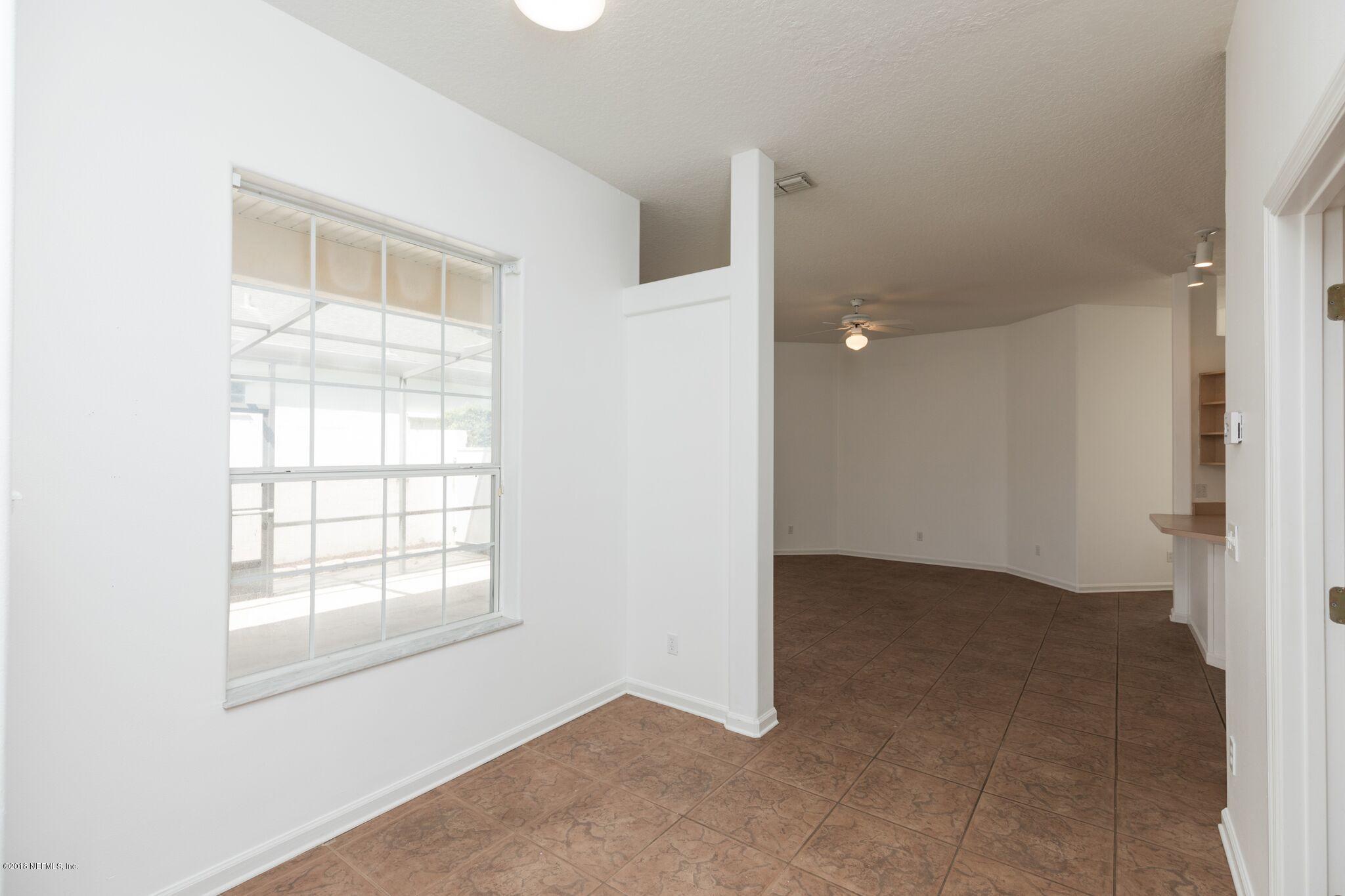 128 Cedar Ridge Circle St. Augustine, FL 32080 - Photo 30 of 37 an empty room with windows