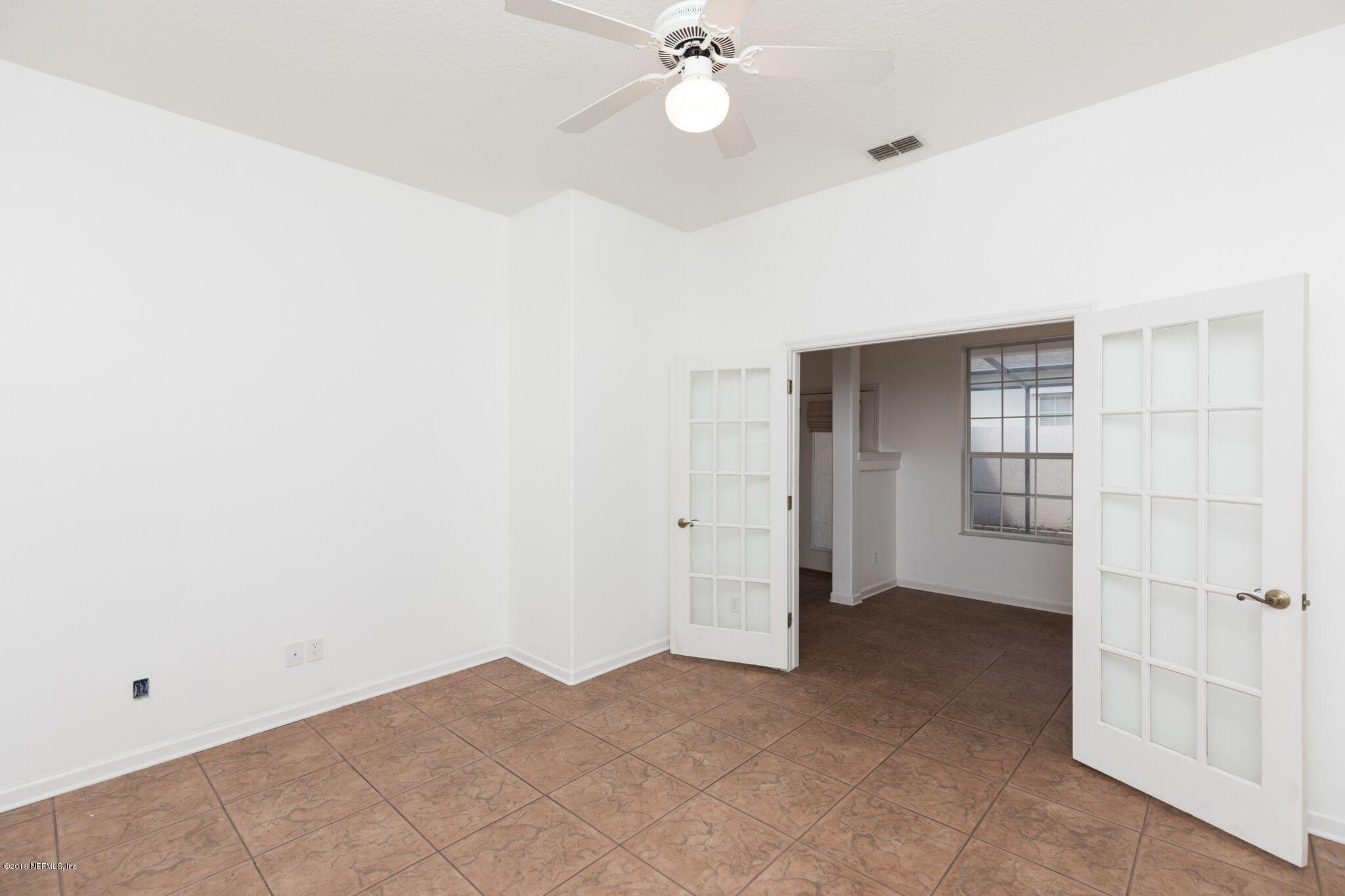 128 Cedar Ridge Circle St. Augustine, FL 32080 - Photo 33 of 37 a view of an empty room with a window