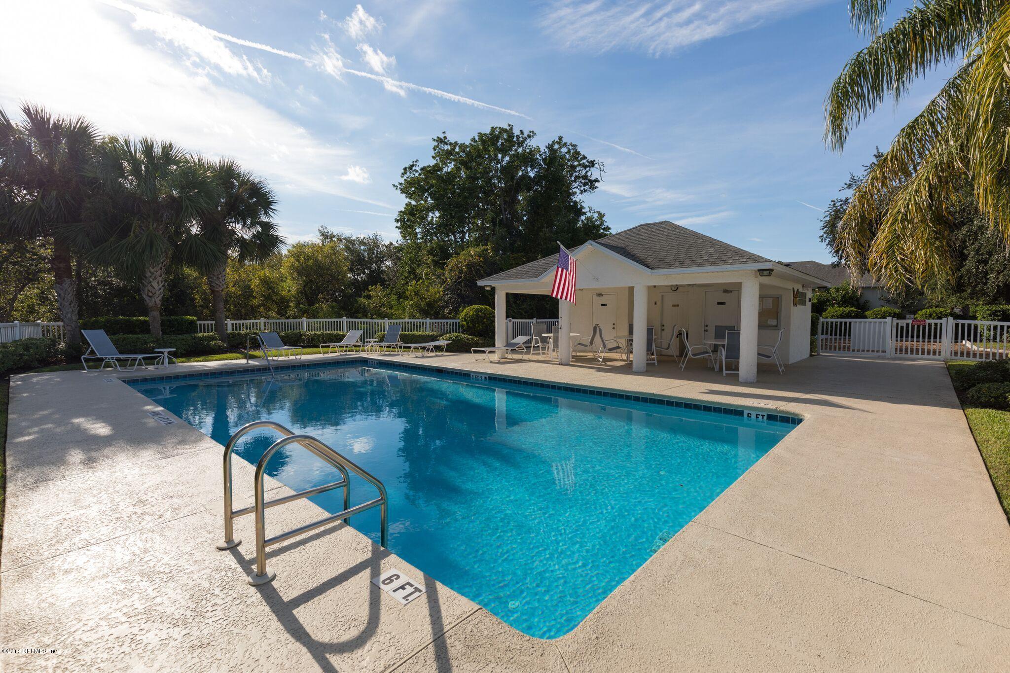 128 Cedar Ridge Circle St. Augustine, FL 32080 - Photo 37 of 37 a view of swimming pool with lawn chairs and plants