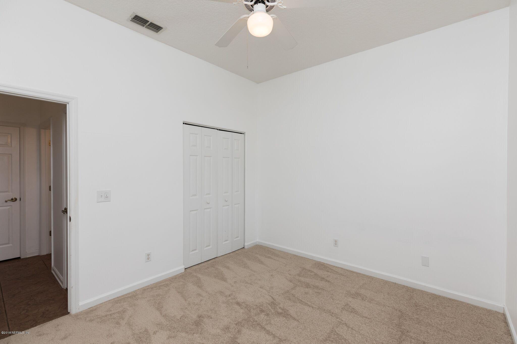 128 Cedar Ridge Circle St. Augustine, FL 32080 - Photo 8 of 37 an empty room with a window