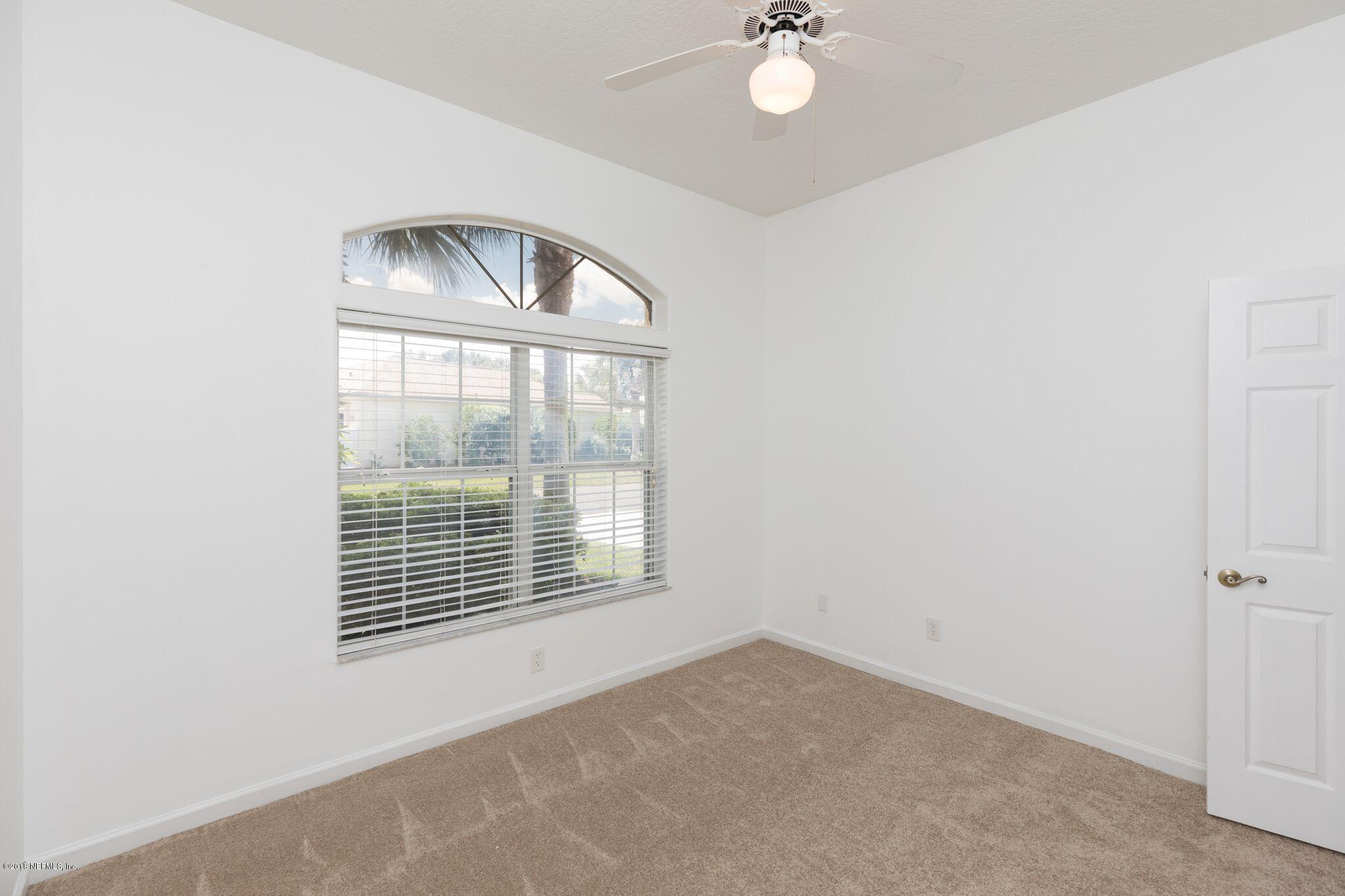 128 Cedar Ridge Circle St. Augustine, FL 32080 - Photo 10 of 37 an empty room with a window