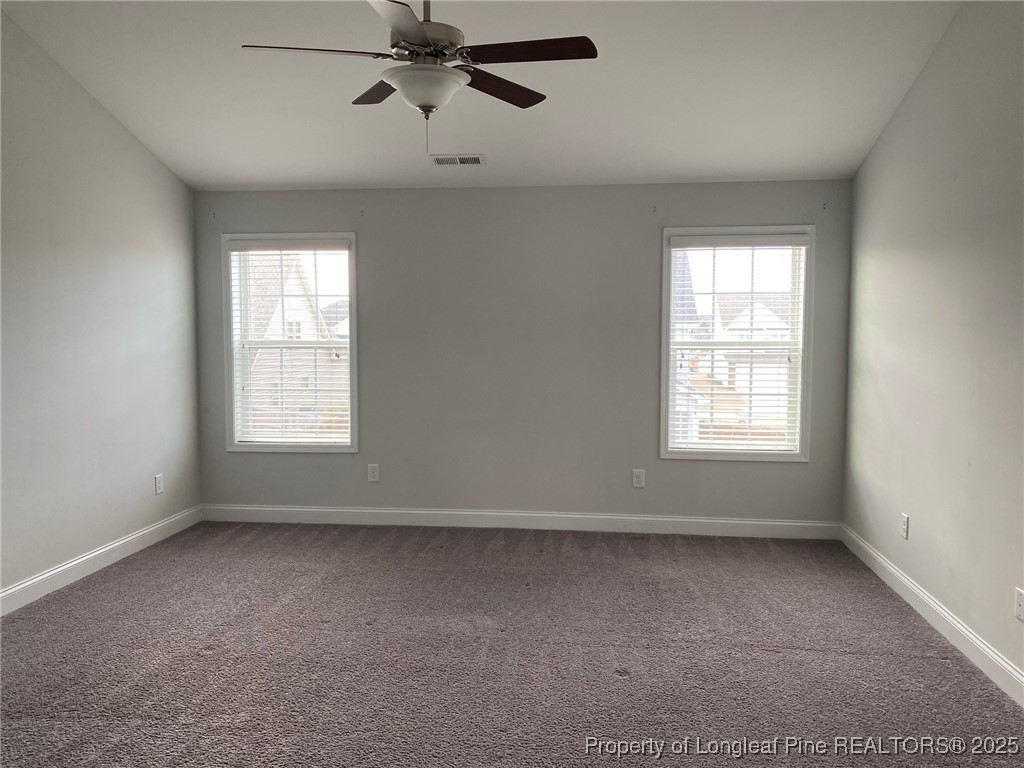 277 Pendleton Street Raeford, NC 28376 - Photo 11 of 29 an empty room with a window