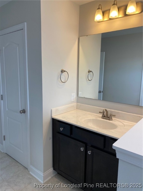 277 Pendleton Street Raeford, NC 28376 - Photo 13 of 29 a bathroom with a sink and a mirror