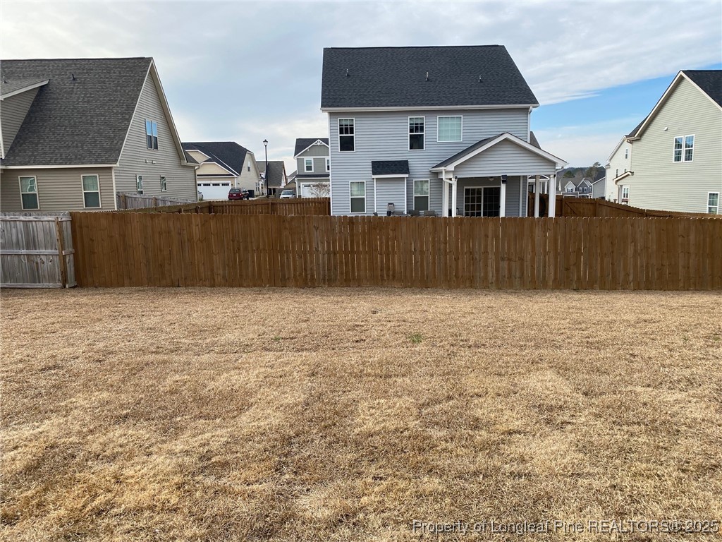 277 Pendleton Street Raeford, NC 28376 - Photo 23 of 29 a view of a house with a backyard