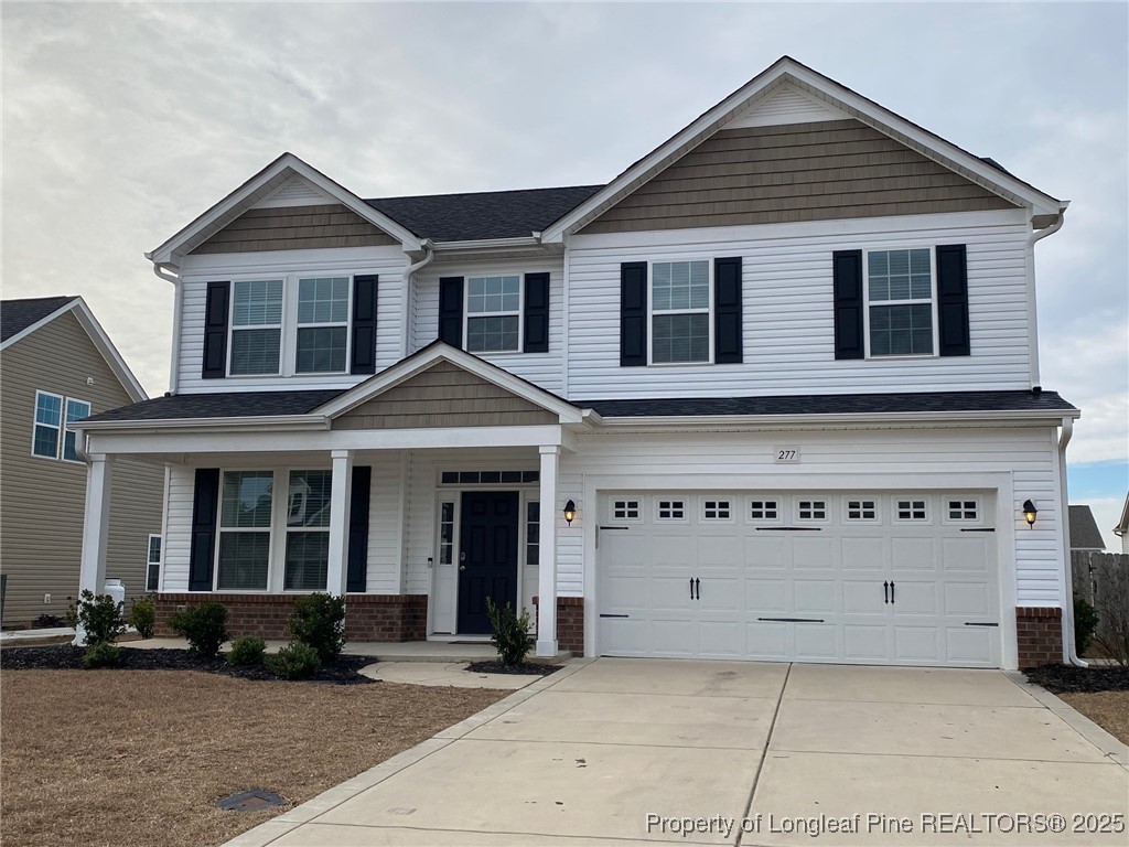 277 Pendleton Street Raeford, NC 28376 - Photo 29 of 29 a front view of a house with a yard