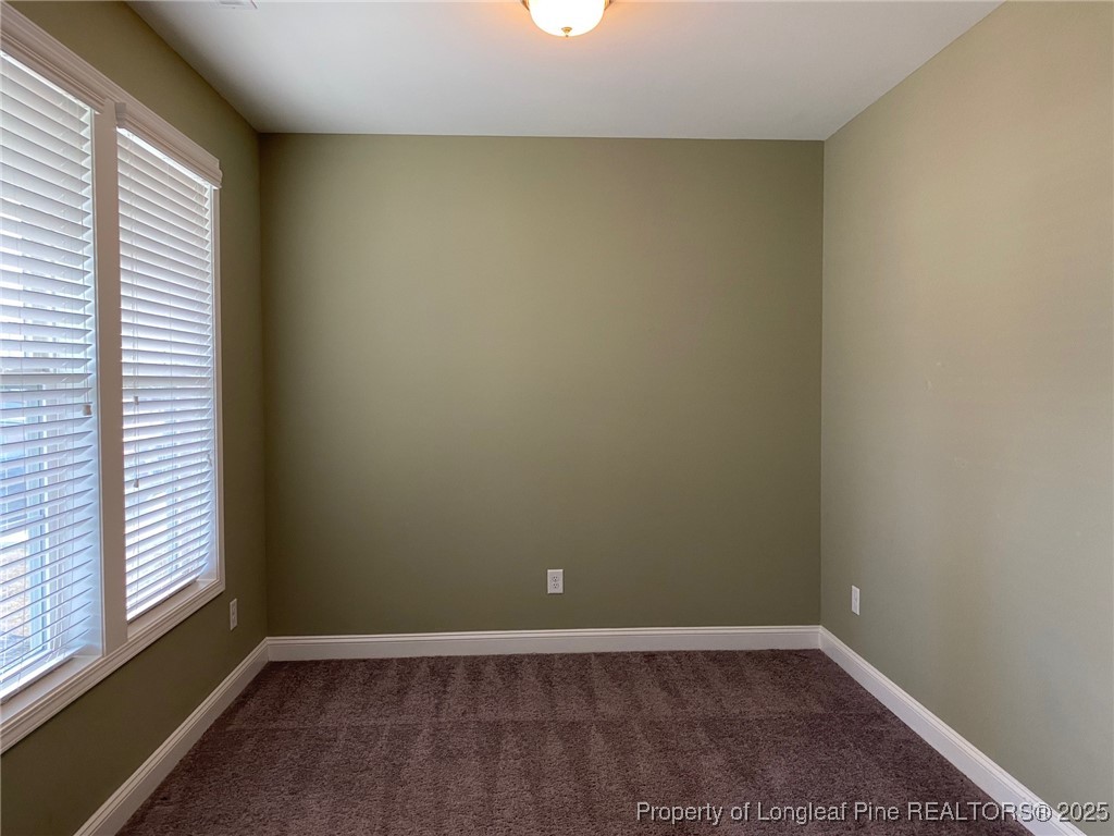 277 Pendleton Street Raeford, NC 28376 - Photo 9 of 29 an empty room with a window