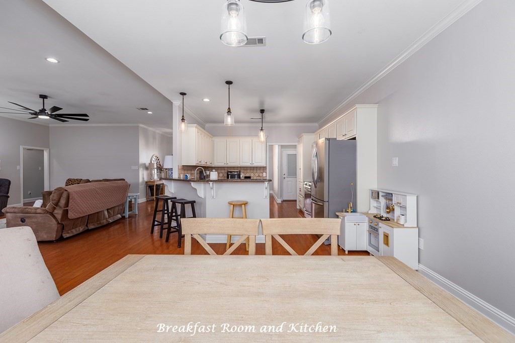 298 Spring Creek Drive Nacogdoches, TX 75965 - Photo 18 of 45 a living room with stainless steel appliances kitchen island granite countertop furniture a rug kitchen view and a chandelier