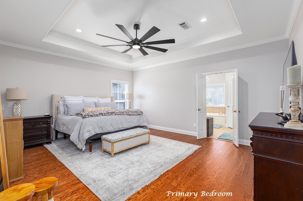 298 Spring Creek Drive Nacogdoches, TX 75965 - Photo 21 of 45 a spacious bedroom with a bed and dresser