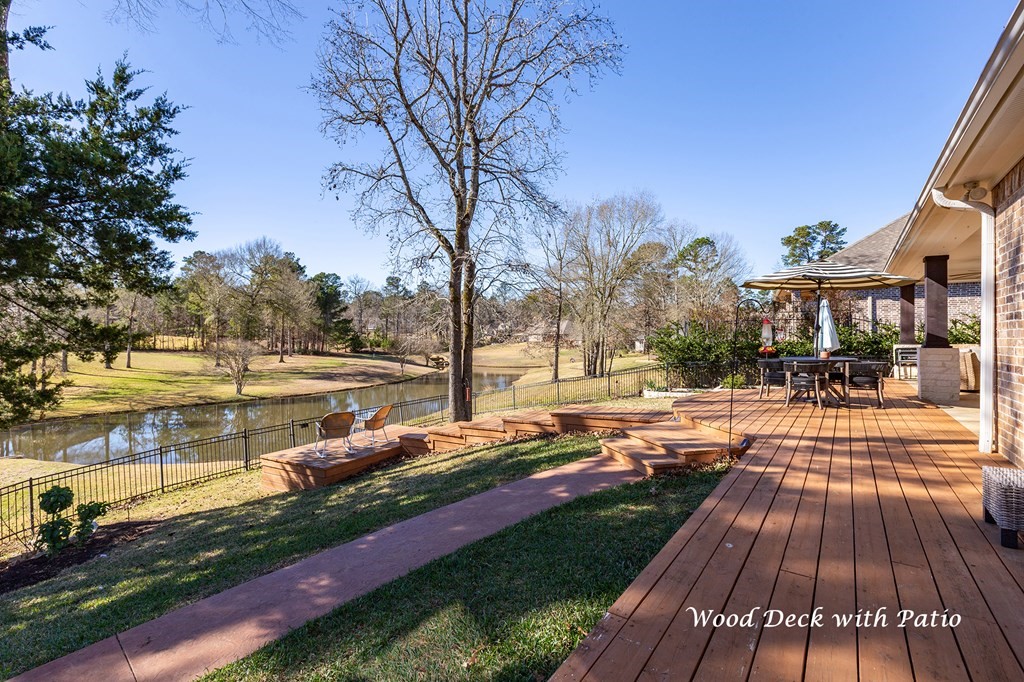 298 Spring Creek Drive Nacogdoches, TX 75965 - Photo 33 of 45 a view of a yard with plants and large trees