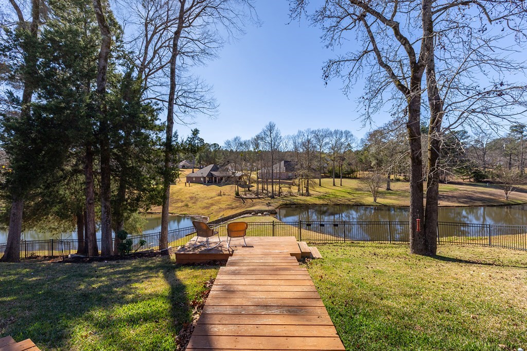 298 Spring Creek Drive Nacogdoches, TX 75965 - Photo 37 of 45 a view of a lake with houses