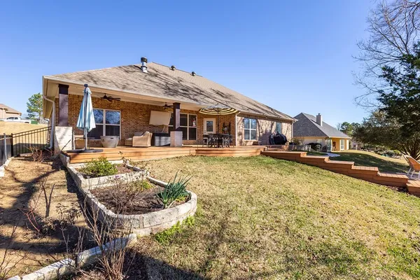 a swimming pool view with a outdoor seating