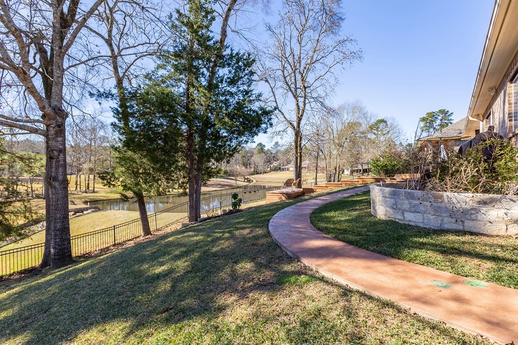 298 Spring Creek Drive Nacogdoches, TX 75965 - Photo 39 of 45 a view of a yard with an trees