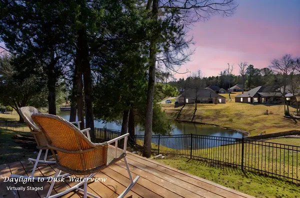 a view of a swimming pool with an outdoor seating