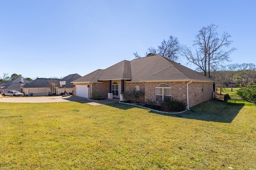298 Spring Creek Drive Nacogdoches, TX 75965 - Photo 41 of 45 a front view of house with yard and swimming pool