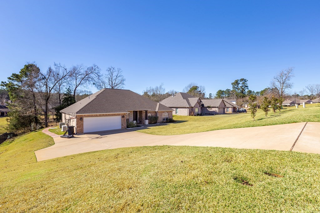 298 Spring Creek Drive Nacogdoches, TX 75965 - Photo 43 of 45 a house with trees in the background