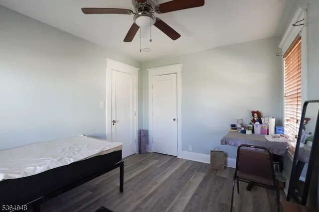 a workspace room with furniture and wooden floor
