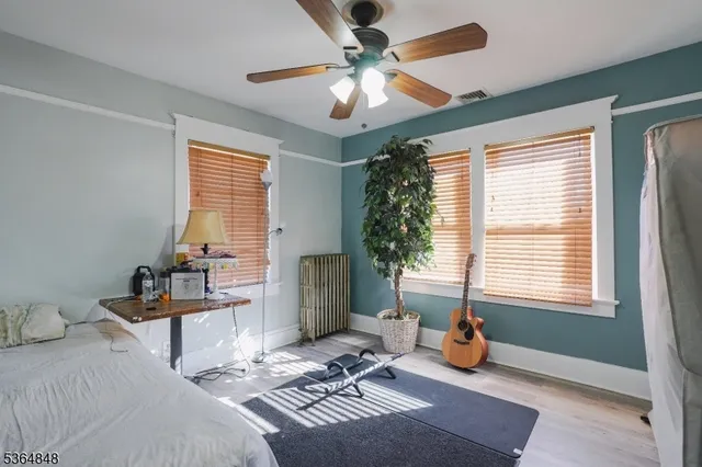 a bedroom with furniture and a chandelier