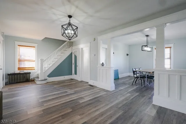 a view of a livingroom with furniture and wooden floor