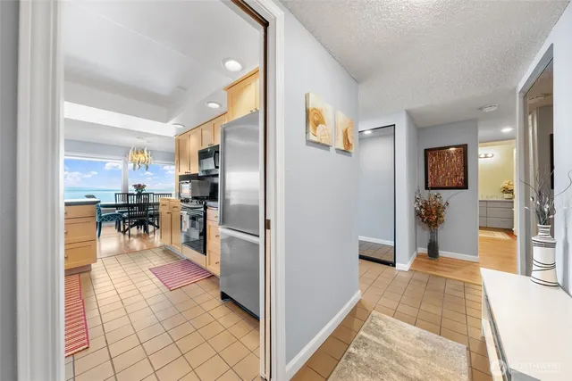 a view of a living room kitchen and a sink